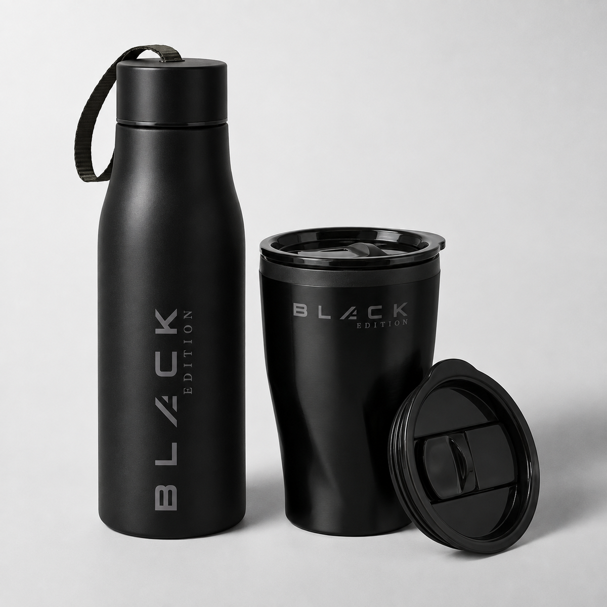 The Black Edition stainless bottle and coffee cup with lid on a white background