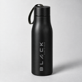 The Black Edition stainless bottle in matte black, with screw cap and woven carry strap, engraved wordmark running vertically up the body.